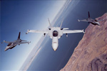 F/A-18 and 2 F-16's in Flight - by George Hall